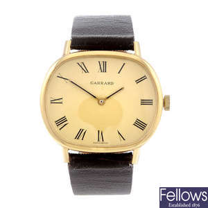GARRARD - a gentleman's gold plated wrist watch together with a Lanco wrist watch.