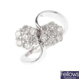 An 18ct gold diamond double cluster ring.