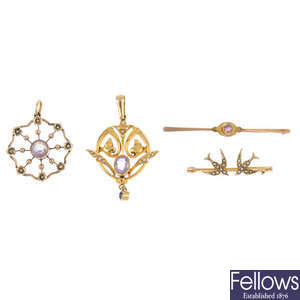 Two early 20th century gold pendants and two brooches