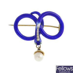 A mid Victorian gold enamel and pearl snake memorial brooch.