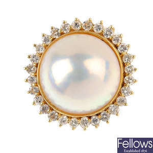 An 18ct gold mabe pearl and diamond cluster ring.
