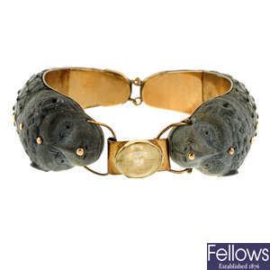 An early 20th century hardstone, lava and ivory bangle.