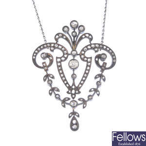 A late 19th century silver diamond pendant, on later chain.
