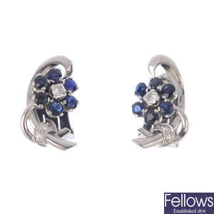 A pair of sapphire and diamond floral earrings.