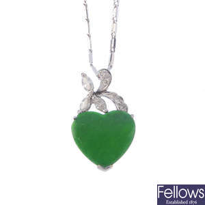 A jade and diamond pendant.