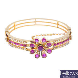 A ruby and diamond floral bangle.