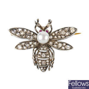 A cultured pearl, ruby and diamond brooch.