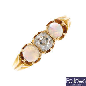 An early 20th century 18ct gold diamond and opal three-stone ring.