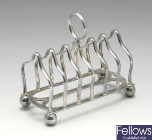 An Edwardian silver toast rack.