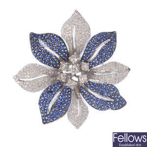 A diamond and sapphire floral brooch.