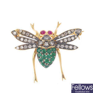A diamond and gem-set fly brooch.