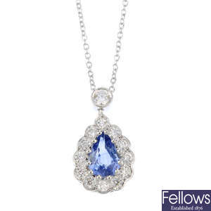 A sapphire and diamond pendant with chain.
