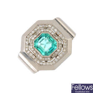 A mid 20th century platinum, Colombian emerald and diamond cocktail ring.