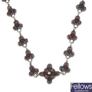 A late 19th century faceted garnet and red paste necklace.
