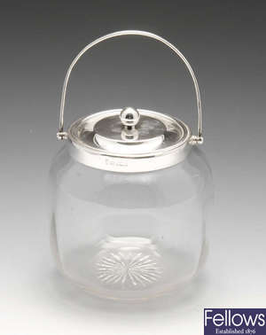 An Edwardian silver mounted glass biscuit barrel.