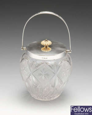 An Edwardian silver mounted cut-glass biscuit barrel.
