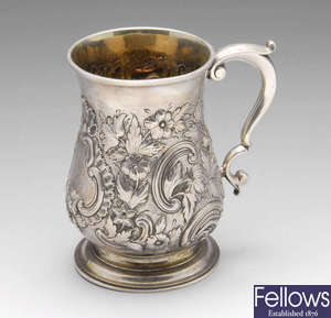 A George II mug with later embossing.