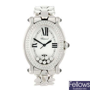 CHOPARD - a lady's 18ct white gold Happy Sport bracelet watch.