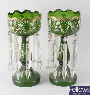 A pair of early 20th century green glass table lustres.
