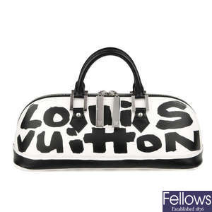 LOUIS VUITTON - a limited edition Long Alma Graffiti handbag.