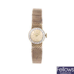 MOVADO - a lady's 9ct yellow gold bracelet watch.