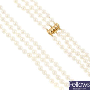 A three row cultured pearl necklace.