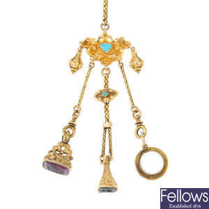 A late 19th century gold gem-set chatelaine and fobs.