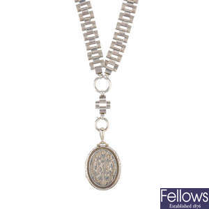 A late 19th century silver locket and collar.