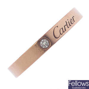 CARTIER - an 18ct gold diamond 'Wedding' band ring.