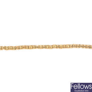 LINKS OF LONDON - an 18ct gold 'Allsorts' bracelet.