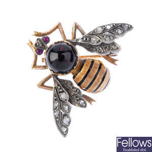 A gem and enamel bee brooch.