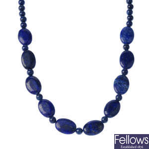 A lapis lazuli necklace and pair of earrings.
