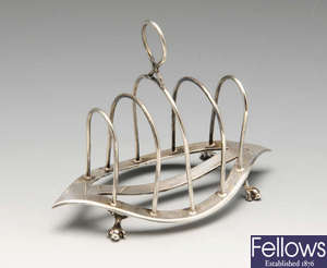 A late Victorian silver toast rack, etc.