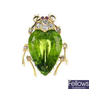 A late Victorian, gold peridot and gem-set insect brooch.