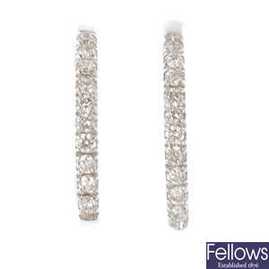 A pair of 18ct gold diamond hoop earrings, and one detachable sapphire and diamond drop.