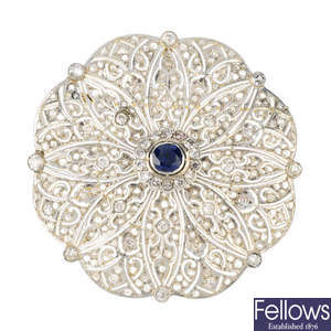 A sapphire and diamond brooch with four additional interchangeable centre panels.