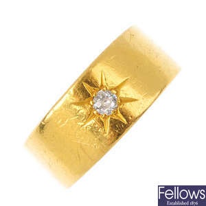 A 1920s 22ct gold diamond band ring.