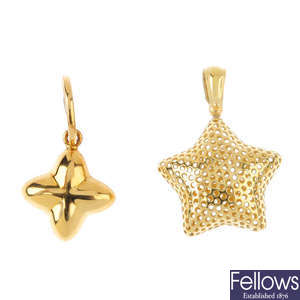 Two 18ct gold star pendants.