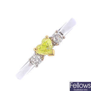 A Fancy Intense Green-Yellow diamond and diamond dress ring.