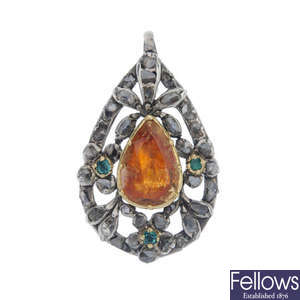 An early 19th century silver and gold diamond and gem-set pendant.