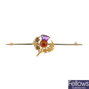 An early 20th 18ct gold gem thistle bar brooch.