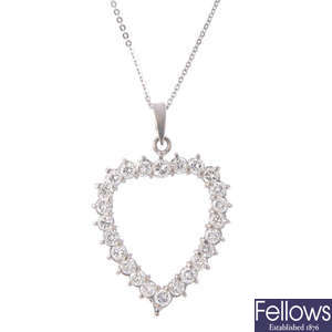 A 14ct gold diamond heart pendant with chain.