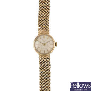 LONGINES - a lady's mid 20th century 9ct gold automatic watch.