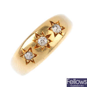 A mid 20th century gold diamond three-stone ring.
