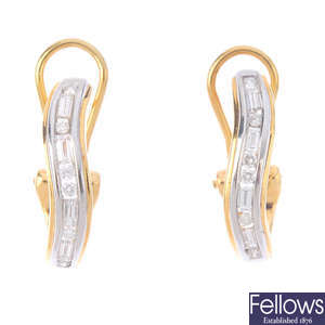 A pair of 18ct gold diamond elongated hoop earrings.