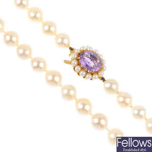 A cultured pearl necklace, with 9ct gold amethyst and seed pearl clasp.
