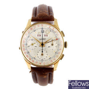 EBERHARD & CO. - a gentleman's yellow metal triple date chronograph wrist watch.