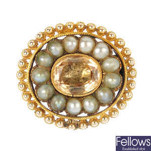 A mid Victorian gold foil-back topaz and split pearl cluster brooch, circa 1850.