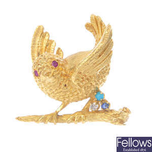 A 1960s 18ct gold diamond and gem-set bird brooch.