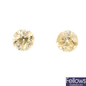 Two brilliant-cut diamonds, weighing 0.63 and 0.60ct.